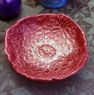 very pretty red bowl with wavy edge