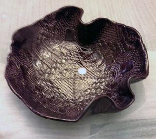 metallic-looking bowl with wavy edges
