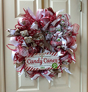 A wonderful candy cane wreath, with Christmas colors of red and white.