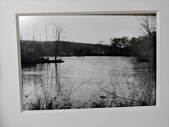 framed black & white photograph of a wintery river