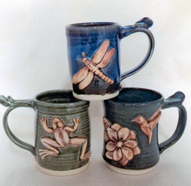 ceramic mugs with raised anmal shapes