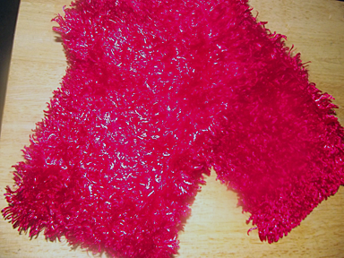 Pink furry scarf.