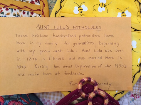 An index card tells the story of the crafter's great aunt Lulu who was married in 1998 and made pot-holders like these. In the depression, the 1930s, she made them out of feed-sack-cloth.