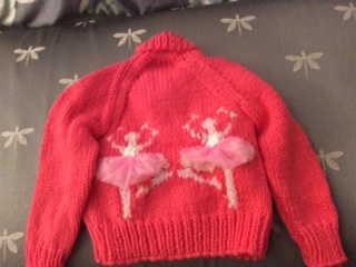 back of red ballerina sweater