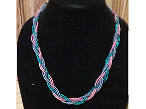 beaded necklace in pink, blue and teal braided together-about 22 inches