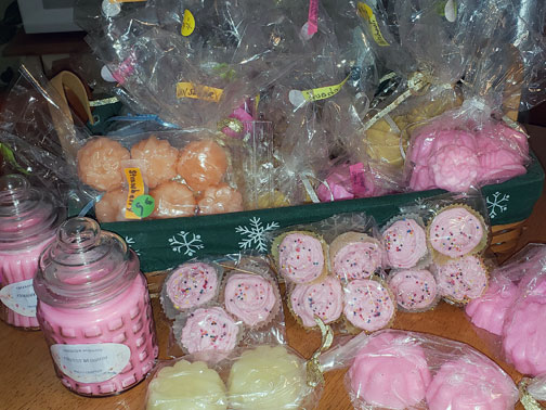 Jars of candles, bags of colored tea-lights, candles looking like frosted cupcakes.