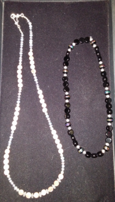 2 necklaces, one black, one white