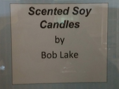 It's a sign saying "Scented Soy Candles".