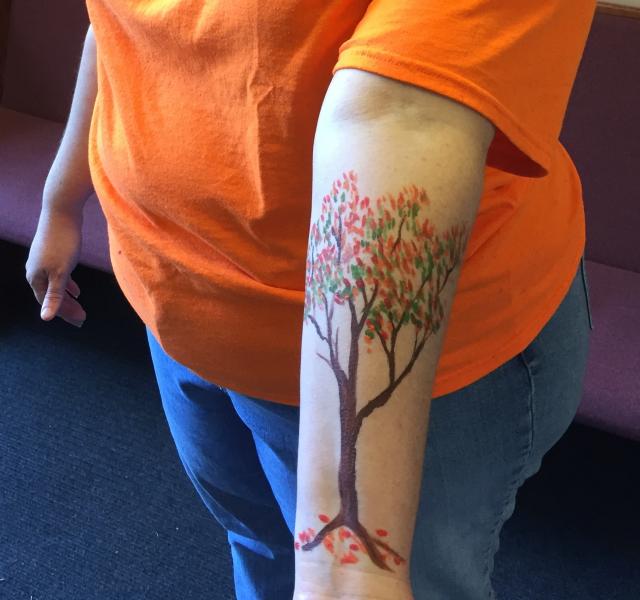 tree painted on arm