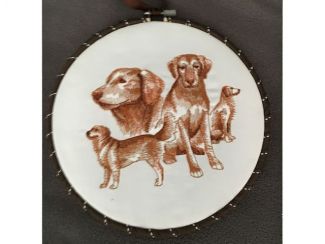 embroidered drawing of dogs