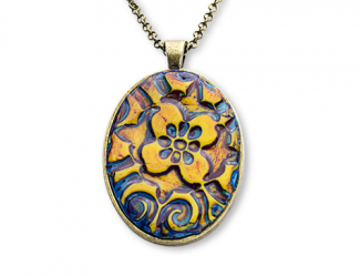 An interesting oval pendant, on silver backing and chain, with a cloissonne flower design of amber color on Prussian blue background.